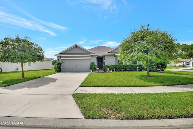 316 Nowell Loop, Deland, FL 32724 - view of front of house with a front lawn, an attached garage, driveway, and stucco siding