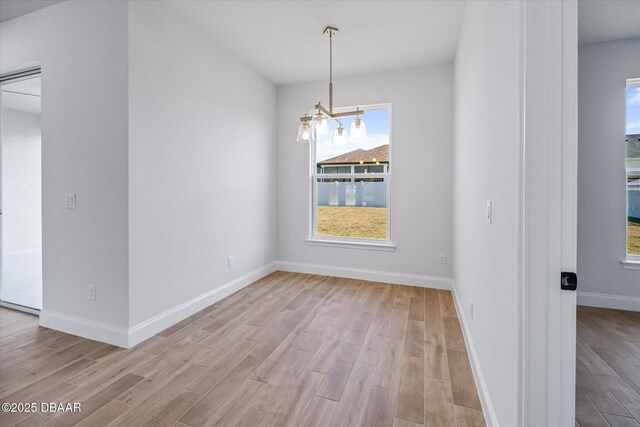 45 Fenhill Ln, Palm Coast, FL 32137 - unfurnished dining area with healthy amount of natural light and light wood-style flooring