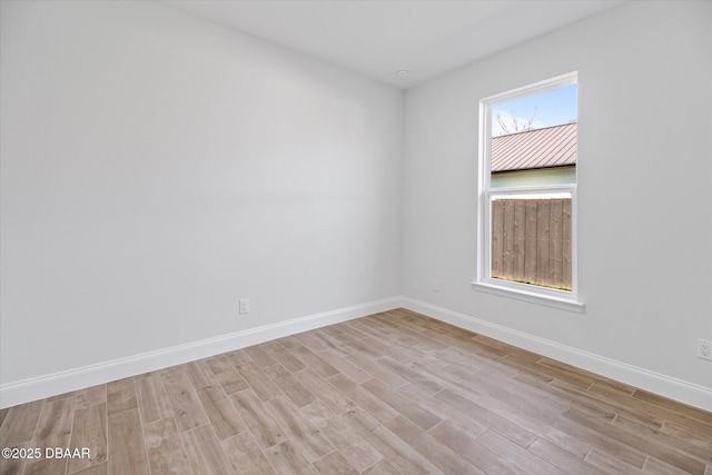 45 Fenhill Ln, Palm Coast, FL 32137 - spare room featuring light wood-type flooring and baseboards
