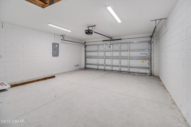 45 Fenhill Ln, Palm Coast, FL 32137 - garage with a garage door opener, electric panel, and concrete block wall