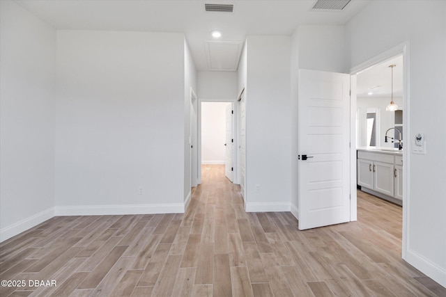 45 Fenhill Ln, Palm Coast, FL 32137 - unfurnished bedroom featuring attic access, light wood-style floors, baseboards, and recessed lighting