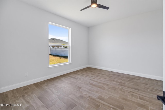 45 Fenhill Ln, Palm Coast, FL 32137 - spare room with a ceiling fan, wood finished floors, and baseboards