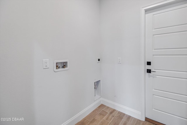 45 Fenhill Ln, Palm Coast, FL 32137 - laundry area with electric dryer hookup, baseboards, light wood finished floors, and washer hookup