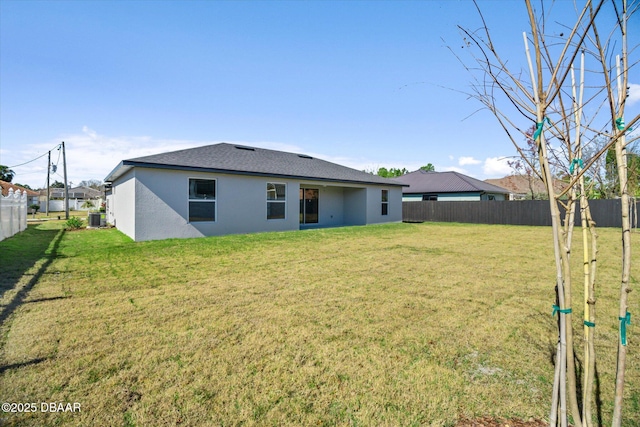 45 Fenhill Ln, Palm Coast, FL 32137 - back of property featuring stucco siding and central air condition unit