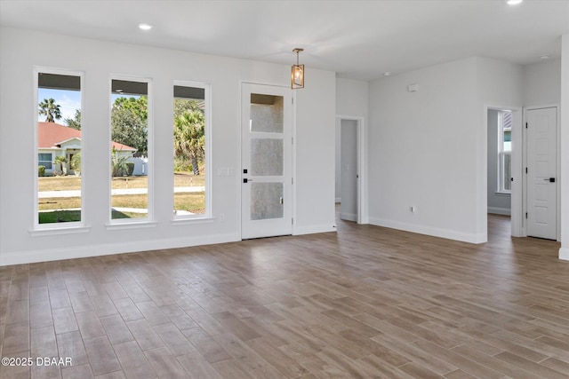 45 Fenhill Ln, Palm Coast, FL 32137 - empty room with wood finished floors, baseboards, and recessed lighting