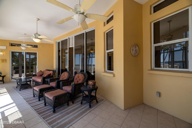 view of patio with an outdoor living space and a ceiling fan