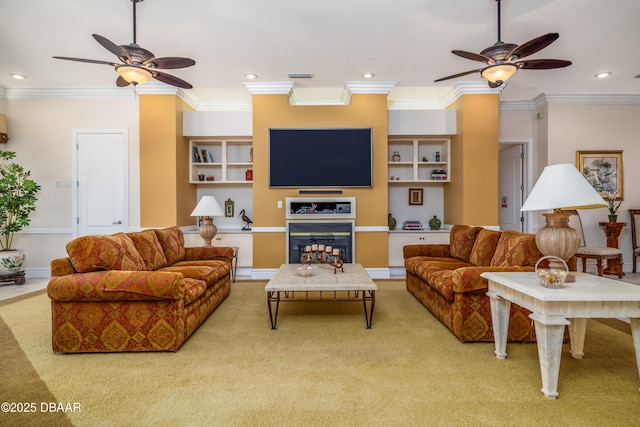 living area featuring ornamental molding, a ceiling fan, and carpet floors