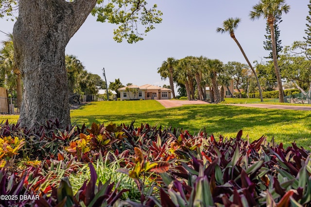surrounding community featuring fence and a lawn