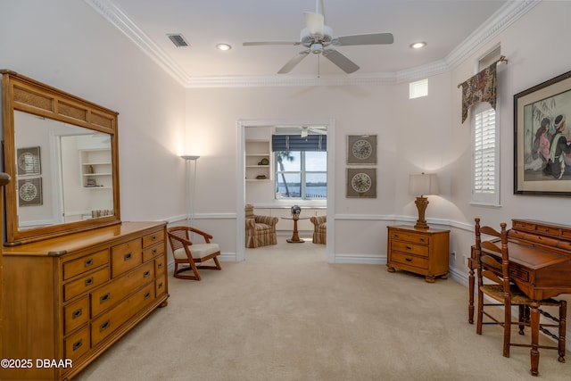 sitting room with baseboards, ornamental molding, a ceiling fan, and light colored carpet