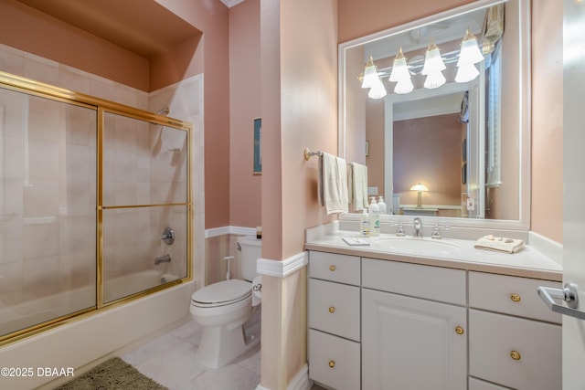bathroom with vanity, a notable chandelier, toilet, combined bath / shower with glass door, and tile patterned flooring