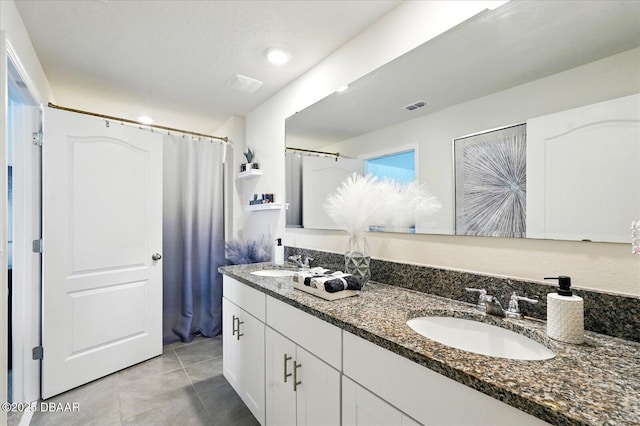 3049 Meleto Blvd, New Smyrna Beach, FL 32168 - bathroom with tile patterned floors and double vanity