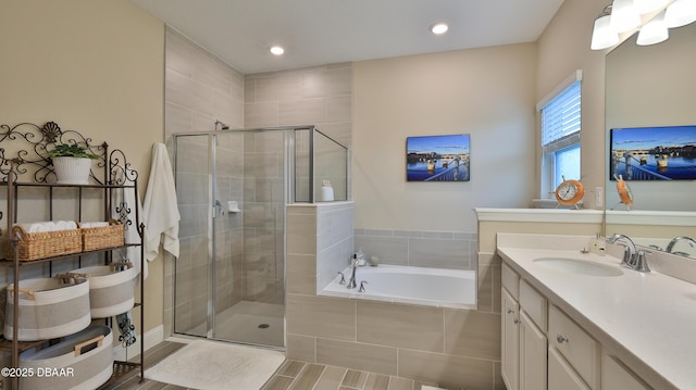 4119 Clifden Dr, Ormond Beach, FL 32174 - bathroom featuring vanity, a shower stall, a garden tub, and recessed lighting