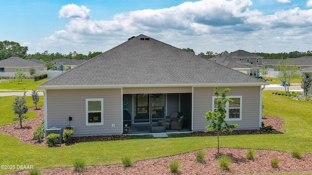 4119 Clifden Dr, Ormond Beach, FL 32174 - back of property featuring a sunroom, a yard, a residential view, roof with shingles, and central air condition unit