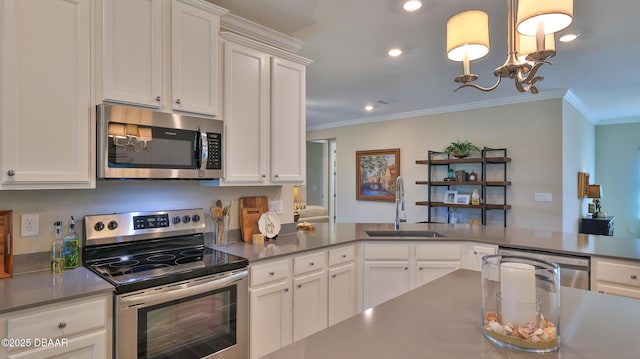 4119 Clifden Dr, Ormond Beach, FL 32174 - kitchen with appliances with stainless steel finishes, ornamental molding, a sink, a chandelier, and white cabinetry
