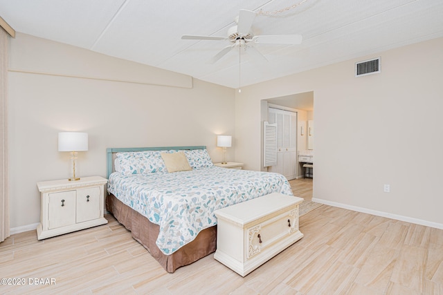 bedroom featuring ceiling fan, a closet, and light hardwood / wood-style floors