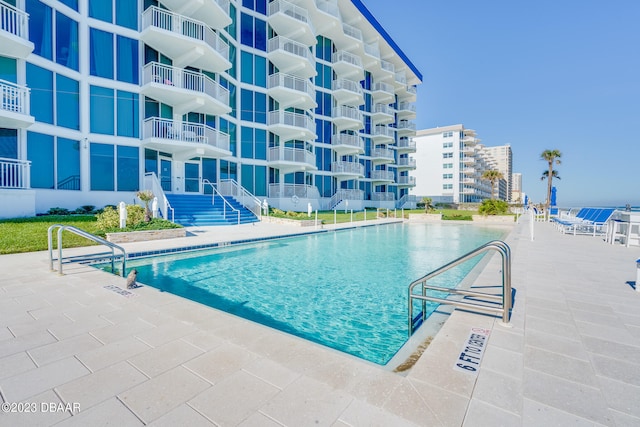 view of pool featuring a patio area