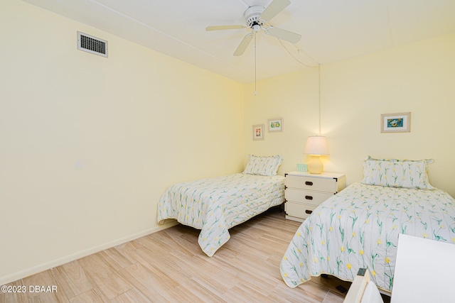 bedroom with hardwood / wood-style floors and ceiling fan