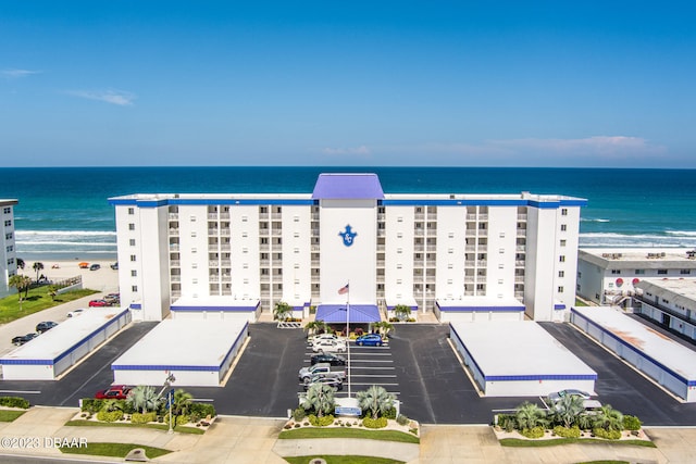 aerial view featuring a water view and a view of the beach