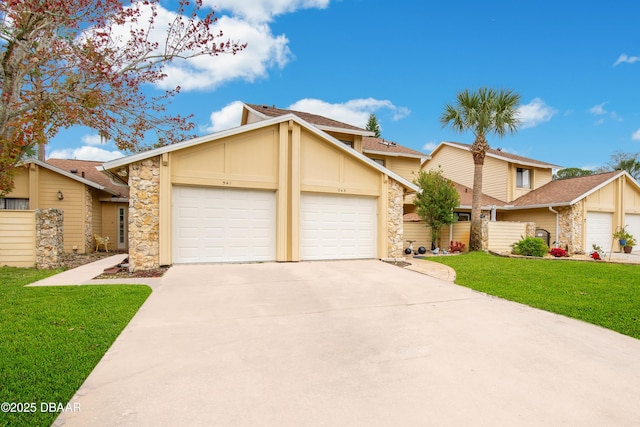 view of front facade featuring a front lawn and a garage