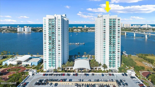 birds eye view of property with a water view