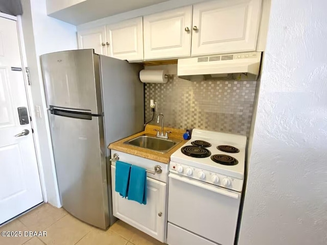 3501 S Atlantic Ave Unit 622, Daytona Beach, FL 32118 - kitchen featuring ventilation hood, white electric range oven, a sink, freestanding refrigerator, and decorative backsplash