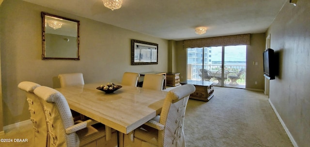 dining room featuring light colored carpet