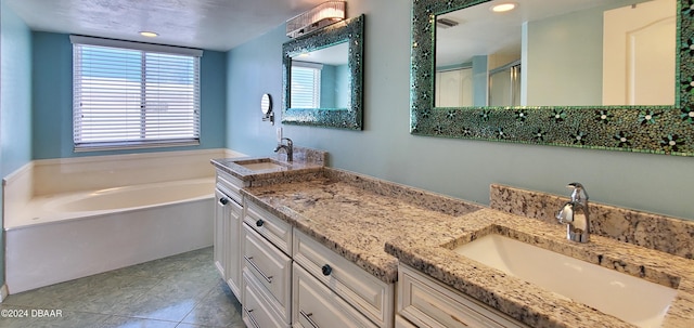 bathroom featuring vanity, tile patterned floors, and shower with separate bathtub