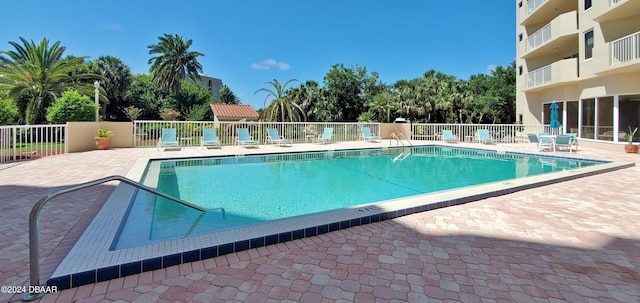 view of swimming pool featuring a patio