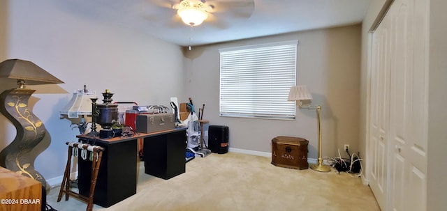 carpeted office with ceiling fan