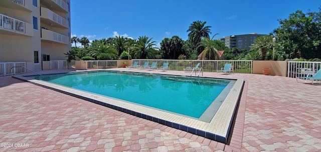 view of swimming pool with a patio area