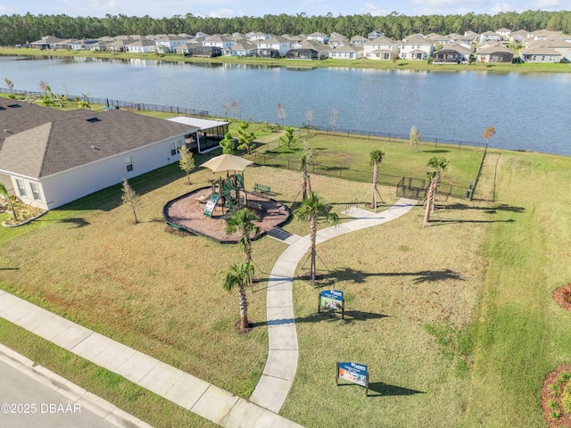 birds eye view of property with a water view