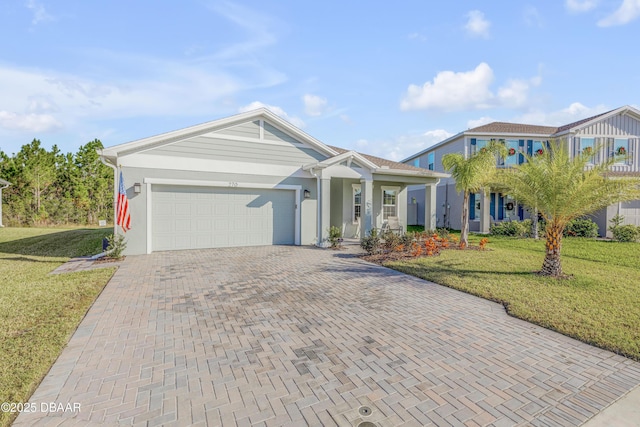 view of front facade featuring a front yard and a garage