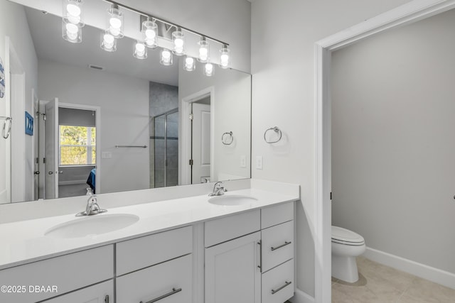 bathroom featuring walk in shower, tile patterned flooring, vanity, and toilet