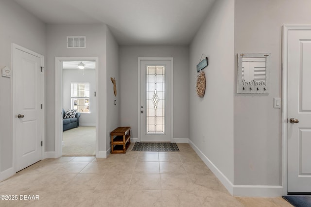 foyer entrance featuring ceiling fan and light tile patterned floors