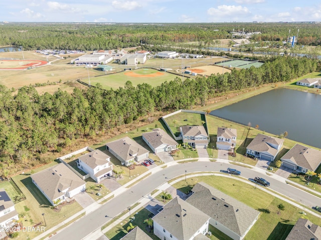 birds eye view of property with a water view