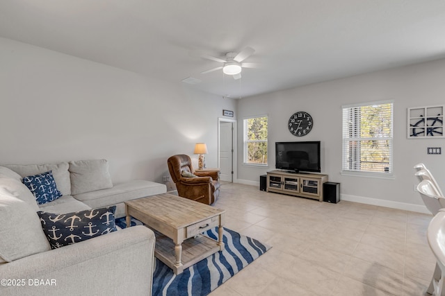 living room featuring ceiling fan and light tile patterned flooring