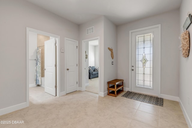 270 Eagle Harbor Way, Daytona Beach, FL 32124 - entrance foyer with baseboards, light tile patterned flooring, visible vents, and plenty of natural light