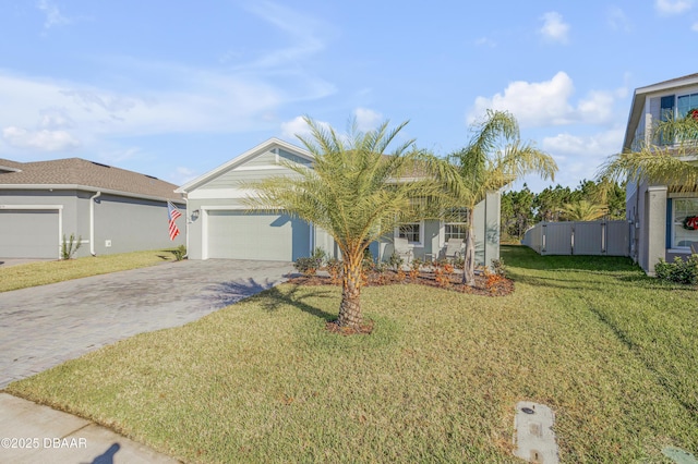 view of front of home with a front lawn and a garage