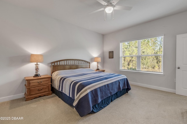 bedroom featuring light carpet and ceiling fan