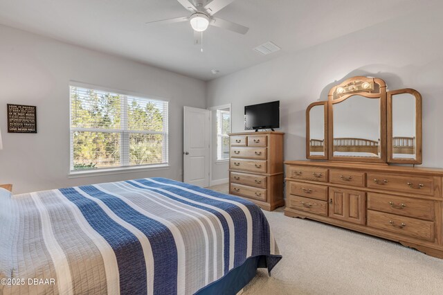 carpeted bedroom with ceiling fan