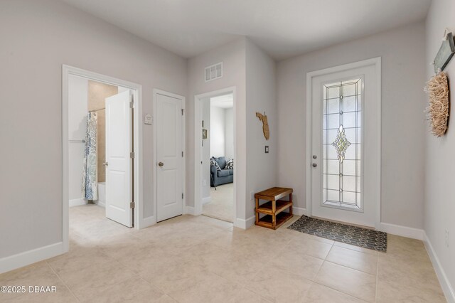 270 Eagle Harbor Way, Daytona Beach, FL 32124 - entrance foyer with baseboards, light tile patterned flooring, visible vents, and plenty of natural light