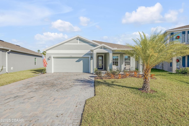 270 Eagle Harbor Way, Daytona Beach, FL 32124 - ranch-style house with a garage, a front lawn, and decorative driveway