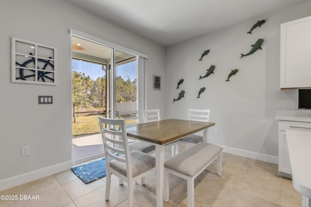 dining space with light tile patterned flooring