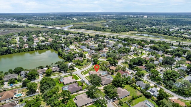 1001 Grassy Rdg, Port Orange, FL 32127 - aerial view of property's location featuring a large body of water and nearby suburban area