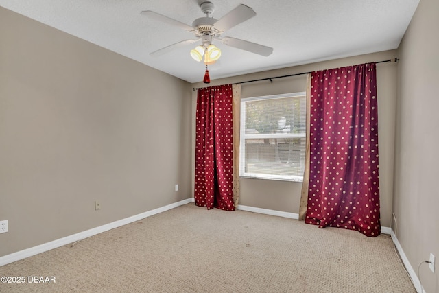 1001 Grassy Rdg, Port Orange, FL 32127 - spare room featuring carpet floors, baseboards, and ceiling fan