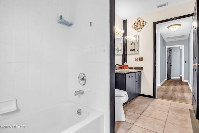 1001 Grassy Rdg, Port Orange, FL 32127 - bathroom featuring vanity, tile patterned flooring, toilet, and  shower combination