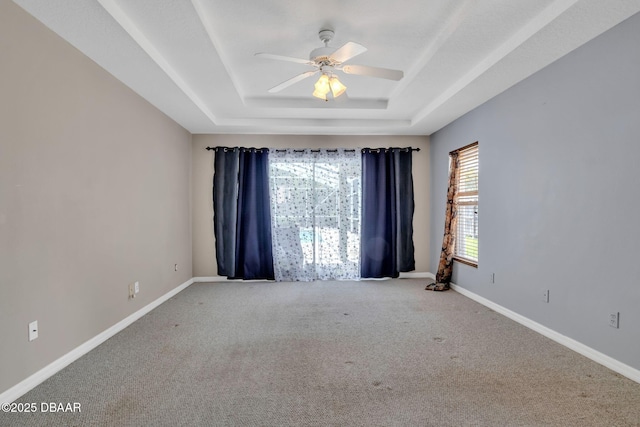 1001 Grassy Rdg, Port Orange, FL 32127 - unfurnished room featuring a raised ceiling, carpet floors, ceiling fan, and baseboards