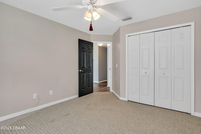 1001 Grassy Rdg, Port Orange, FL 32127 - unfurnished bedroom with carpet flooring, baseboards, a closet, and ceiling fan