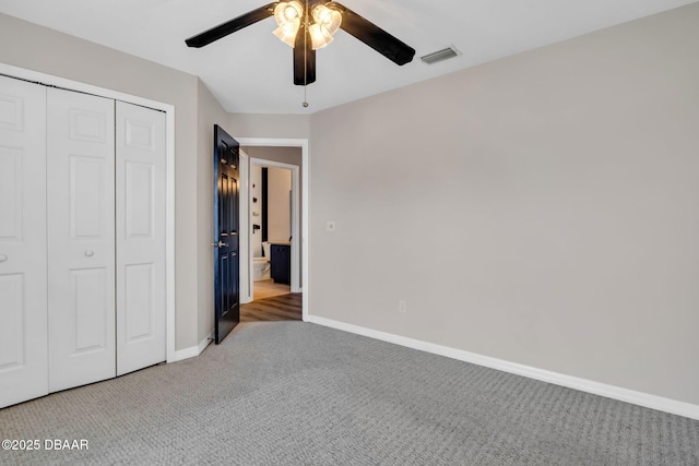 1001 Grassy Rdg, Port Orange, FL 32127 - unfurnished bedroom featuring carpet, baseboards, a closet, and a ceiling fan