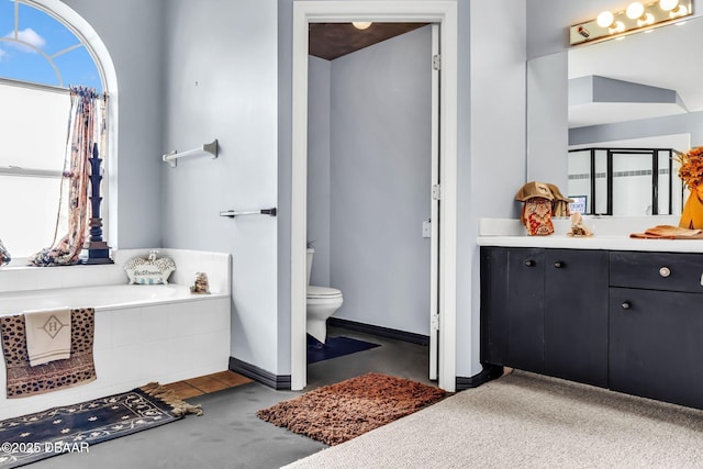 1001 Grassy Rdg, Port Orange, FL 32127 - full bathroom featuring vanity, toilet, a garden tub, and baseboards